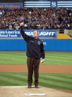 President George W. Bush gives a thumbs-up as he stands on the mound at Yankee Stadium Tuesday, Oct. 30, 2001..