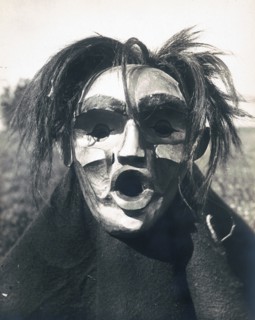 Edward S. Curits Native American Indians -  Person wearing Mask of Tsunukwalahl, a mythical being, used during the Winter Dance circa 1914.