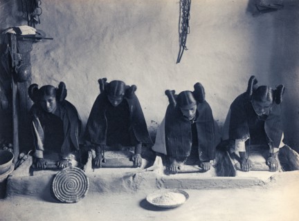 Edward S. Curtis Native American Indians - four young Hopi Indian women grinding grain circa 1906.