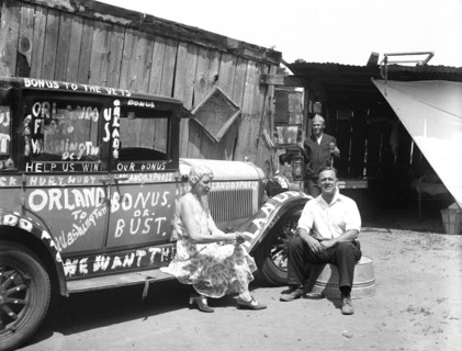 Woman and man next to automobile, participants for the Bonus protest: Orlando to Washington, Bonus or Bust circa 1932.
