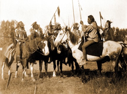 Edward S. Curtis Native American Indians - Six Crow Indians in full regalia, on horseback, Montana circa 1908.