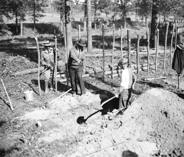 'A' boss is shown here instructing a transient worker in ditch digging at 'Tugwelltown,' a.k.a. Greenbelt, Maryland circa October 1935.