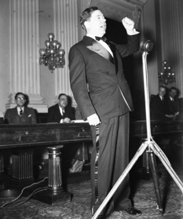 Senator Huey P. Long speaking in early 1935 .