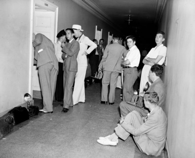 Photographers in hallway waiting circa 1936.