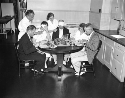 Blindfolded man and woman are part of a Meat testing experiment at the U.S. Department of Agriculture circa 1936.