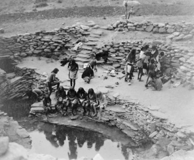 Edward S. Curtis Native American Indians -  Hopi Indians gathered at oasis, some seated at water, others standing in background circa 1905.