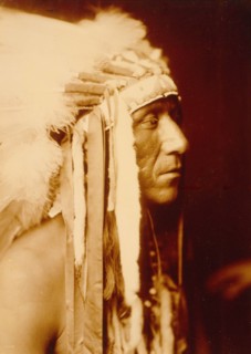 Edward S. Curtis Native American Indians - Pretty Paint, Crow man, head-and-shoulders portrait circa 1905.