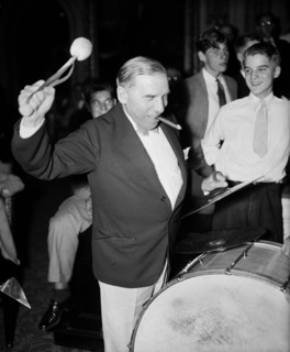 Congressional musicians, gave the House a treat last night, by playing a number of old tunes. Congressman playing a drum and smoking cigar 8/27/35.