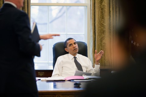 President Barack Obama is briefed prior to making phone calls to foreign leaders in the Oval Office 1/26/09..