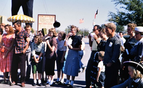 A crowd at the Texas State Fair (a few eating cotton candy) circa 1954-1956.
