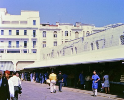 Vendors and customers at a food market in Casablanca Morocco circa 1969.