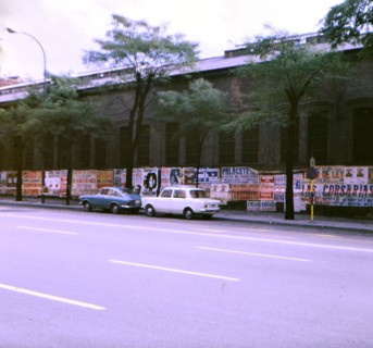 Cars parked along a road in Madrid circa 1969.