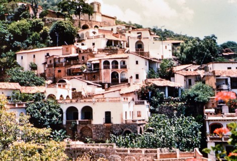 Houses on a hillside in a Mexico city circa 1950-1955 (possibly Taxco Mexico).