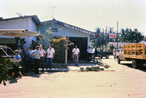 (R) People outside a small restaurant in La Lima Honduras circa 1987.