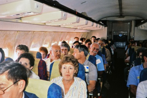 (R) Passengers on an airplane in 1987.