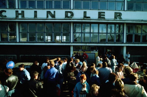 A crowd of East German refugees gathers outside the refugee center in West Berlin..