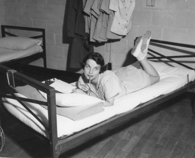 Female Marine writes letter in the barracks