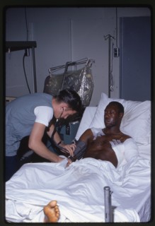 Corpsman Treats Wounded Marine