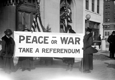 Pacifists holding Peace or War banner