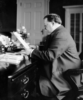 President William Howard Taft sitting at his desk