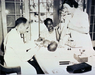 African American infant is getting an injection