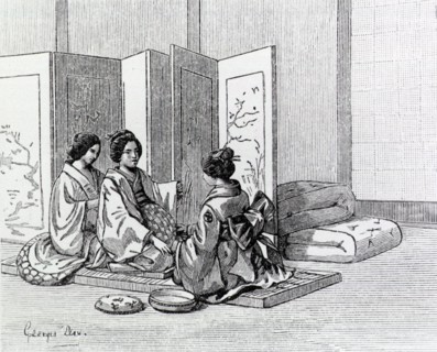 Two Japanese women attend to a woman in labor.