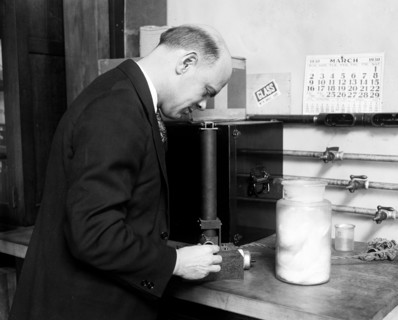 H.J. McNicholas of the Textile Section is shown with his invention