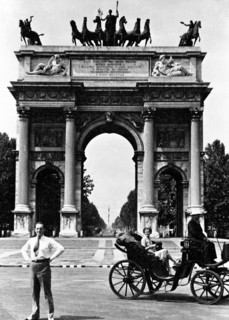 Tourist standing in front of the Arco della Pace in Milan Italy