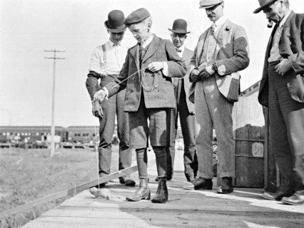 Four men [on a station platform?] at Warman