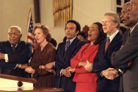 Jimmy Carter and Rosalynn Carter sing with Martin Luther King Sr.