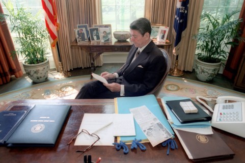 President Reagan reading.