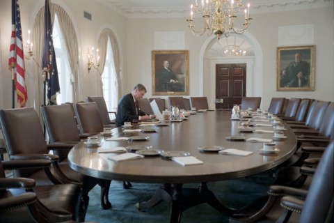 President Reagan working in the White House Cabinet Room.