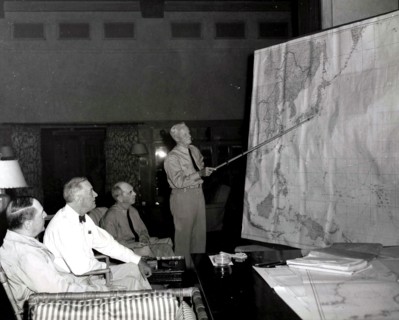 Admiral Chester Nimitz confers with President Roosevelt and officers