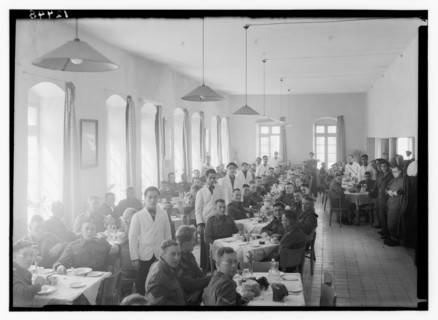 Service men and wait staff or watiers in the dining hall at YMCA hostel (old post office) ca. between 1940 and 1946