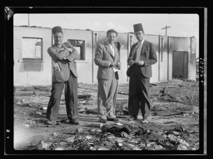 Jacob Simon in Lydda, holding a note pad, interviewing Ethiopian consul ca. between 1934 and 1939