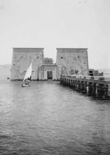 View of 1st pylon of Temple of Isis, Philae, looking North, sailboat in image ca. 1900