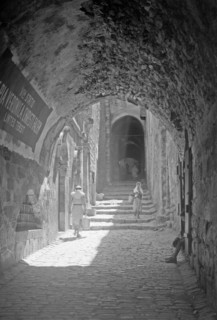 House of Veronica on Via Dolorosa 6th station of the Cross, people walking down the street ca. between 1940 and 1946