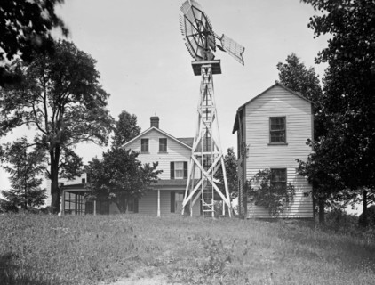 House with windmill. ca.  between 1910 and 1920