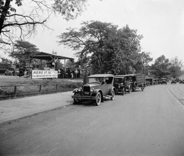 Early 1900s cars and trucks in a line, waiting for a Wasson Motor Check sponsored by the Havoline Oil Company ca.  between 1910 and 1935