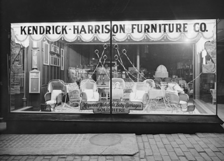 Kendrick Harrison Furniture Company window at night ca.  between 1910 and 1920