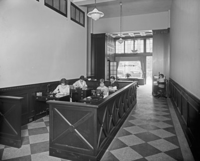 McKeever & Goss, woman working, interior Office ca.  between 1910 and 1935