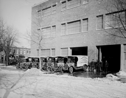 Parked Chestnut Farm Dairy trucks ca.  between 1910 and 1925