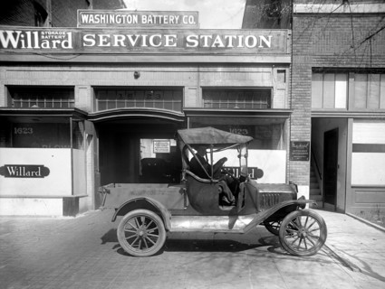 Early pick up truck parked outside the Washington Battery Company / Willard Service Station ca.  between 1910 and 1920