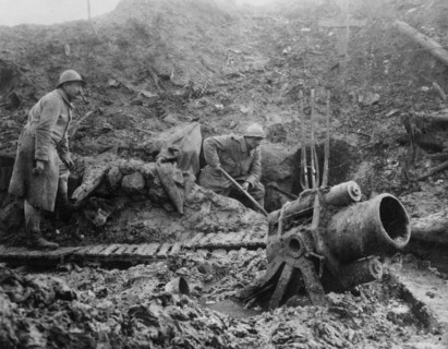 Two soldiers and a formidable weapon (a mortar?) in trench warfare ca.  between 1916 and 1918