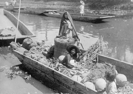 Women and a child on a boat in the MexiCompany Canal, Mexico City ca.  between 1909 and 1920