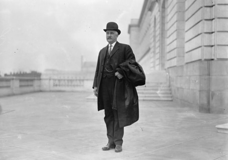 Ex-Gov. Judson Harmon of Ohio holding a top coat ca. between 1909 and 1919