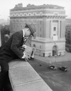 Unidentified photographer with camera ca. between 1909 and 1923