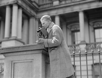 Unidentified photographer with camera ca. between 1909 and 1923