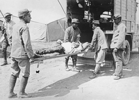 Wounded man on ambulance stretcher ca.  between 1910 and 1935