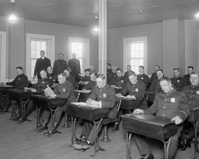 Cadets studying in a classroom at Police School ca. between 1909 and 1940